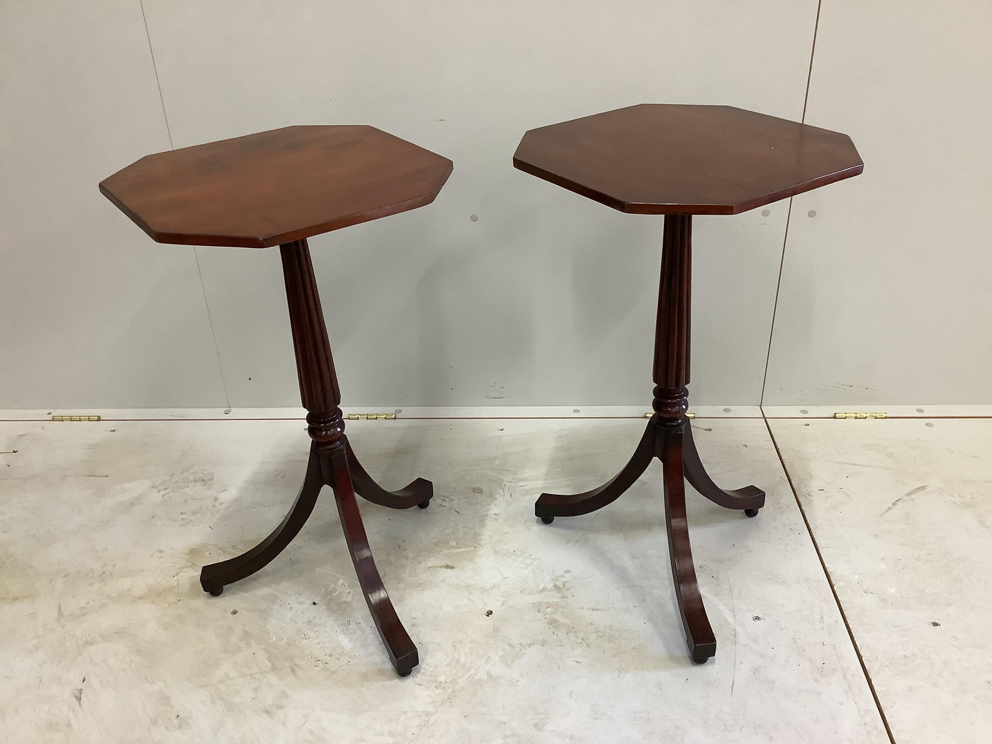 A pair of Regency style octagonal mahogany tripod wine tables, width 39cm, height 74cm